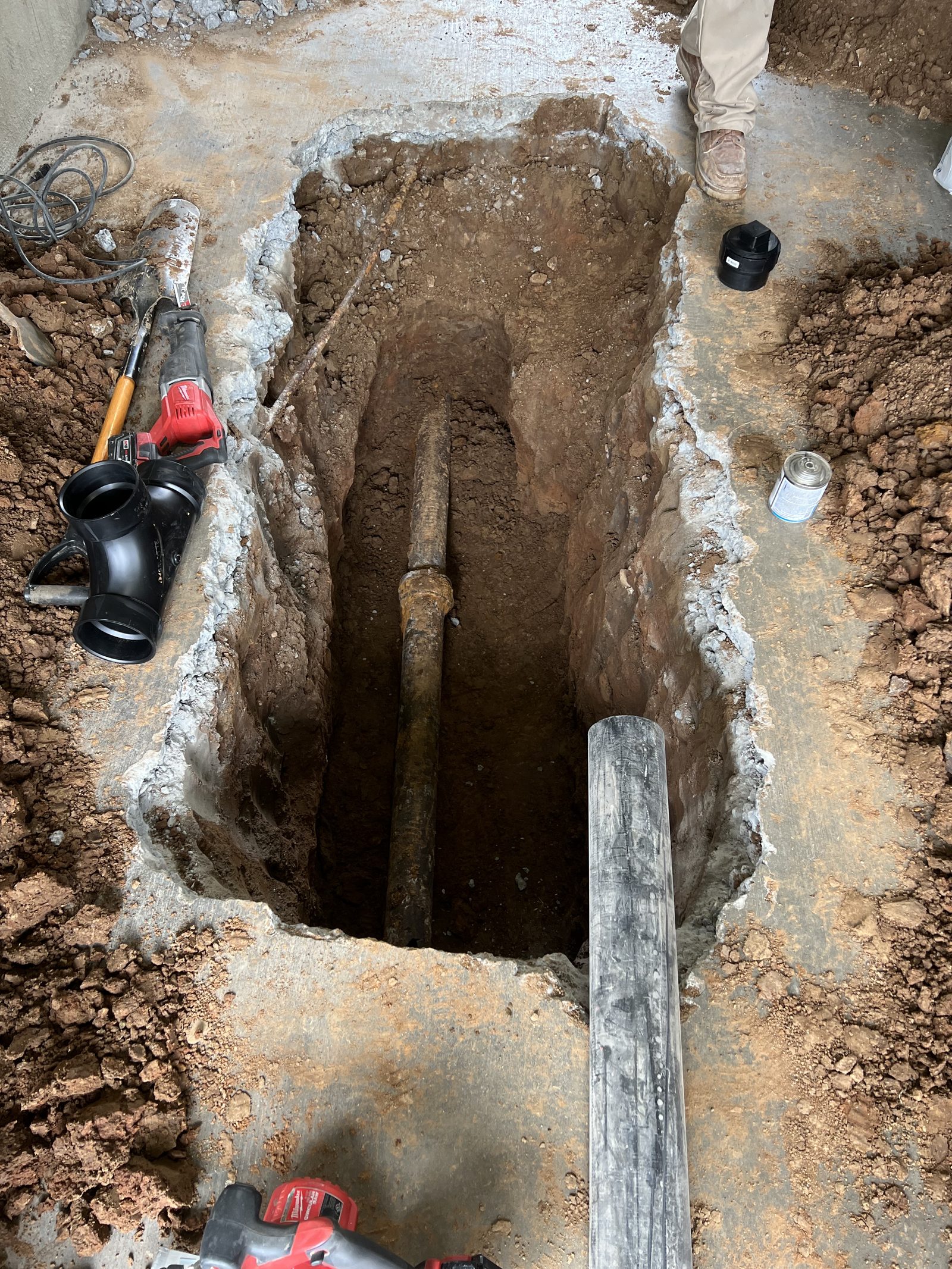 Underground Plumbing — Trench work for sewer line repair and water service replacement.