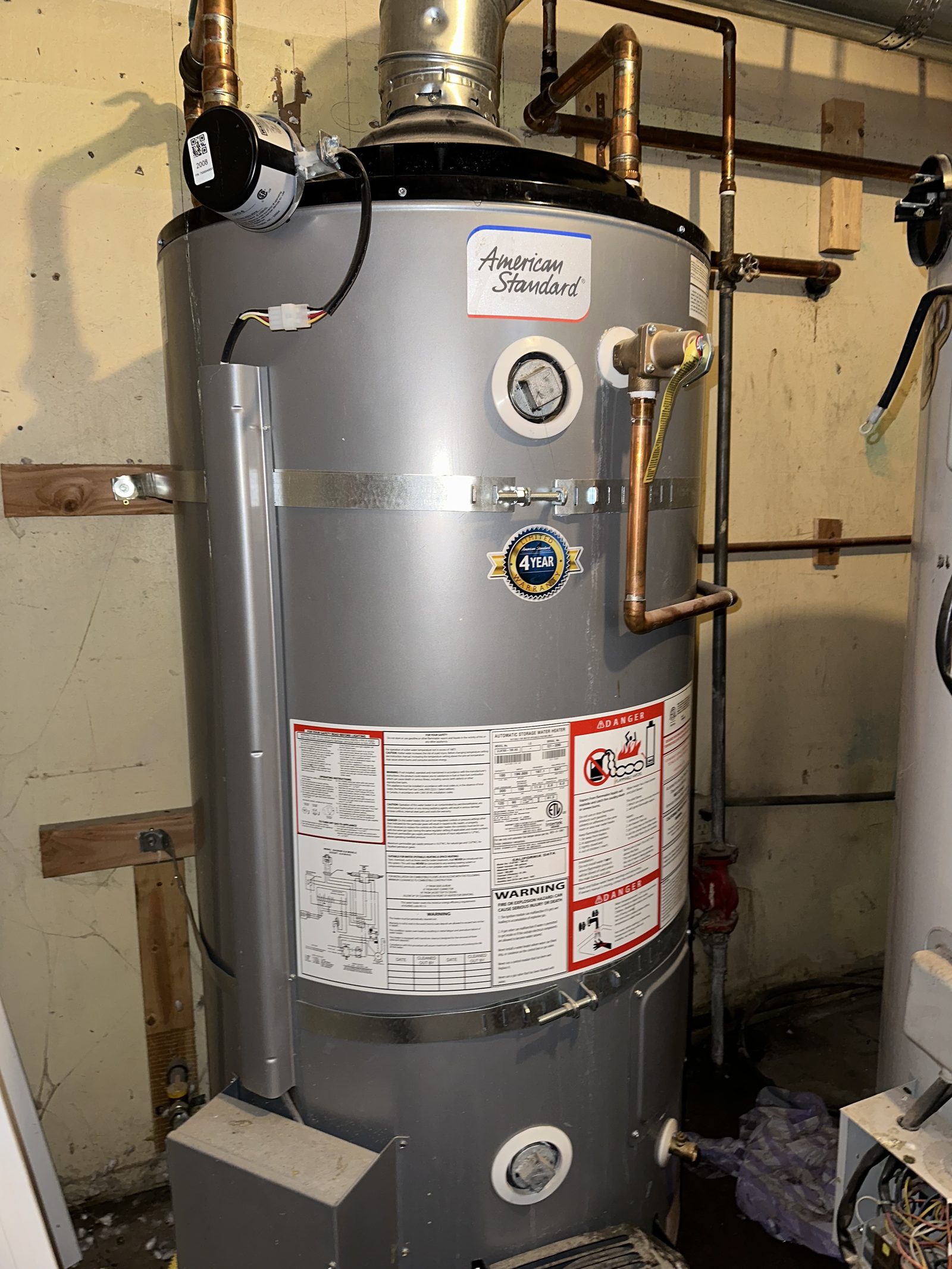 Water Heater Installation — American Standard high-efficiency water heater installed with code-compliant venting and seismic strapping.
