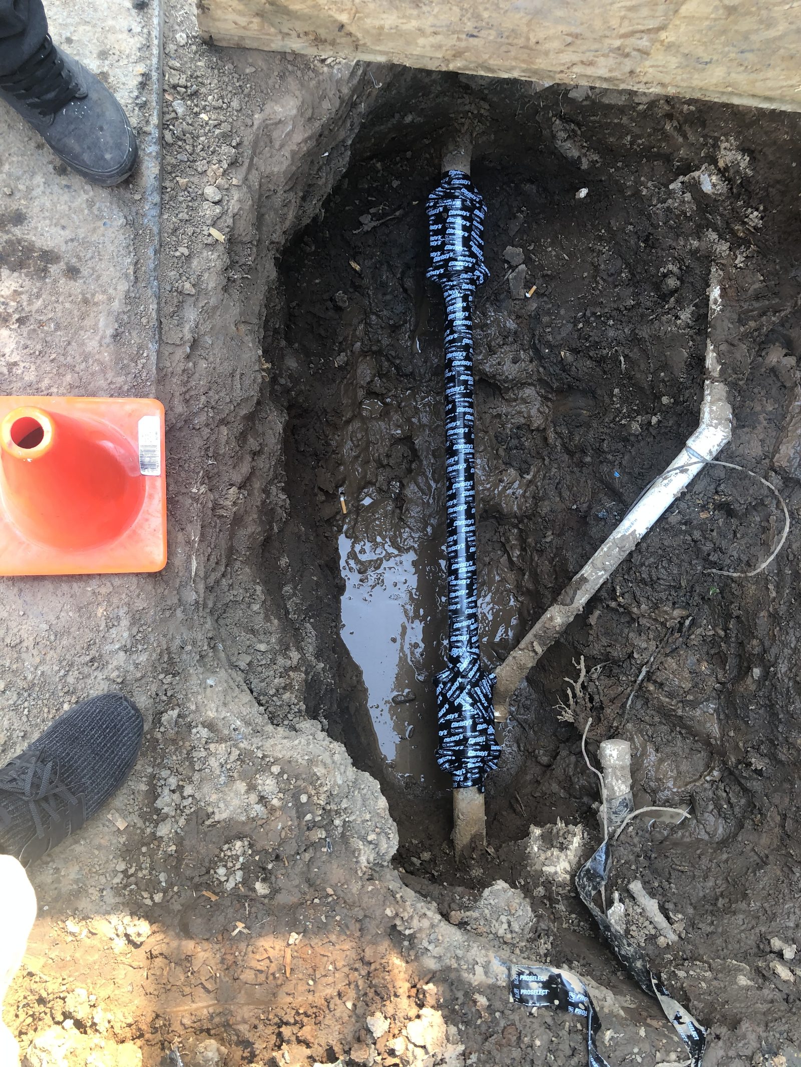 Underground Plumbing — Trench work for sewer line repair and water service replacement.