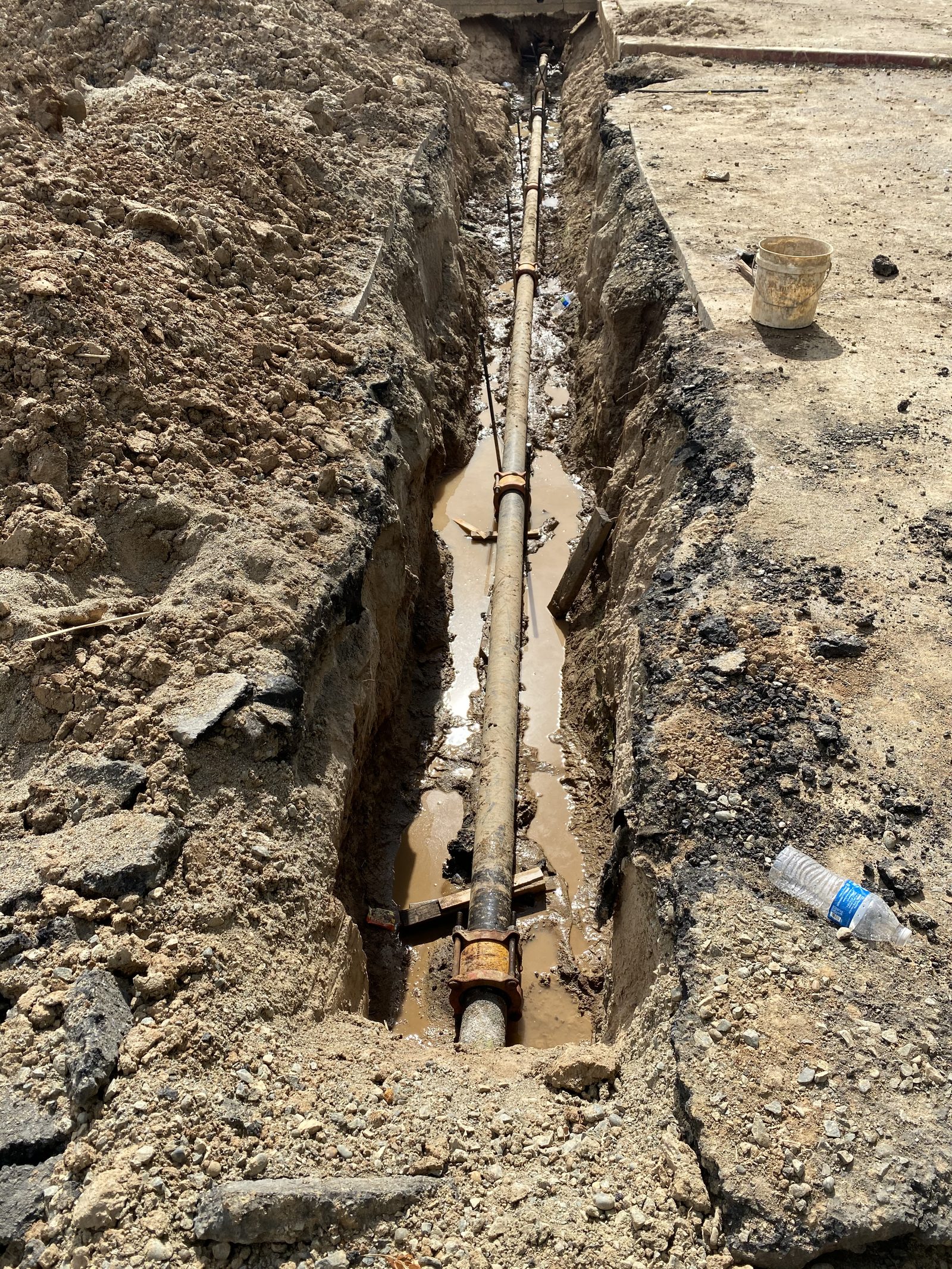 Underground Plumbing — Trench work for sewer line repair and water service replacement.